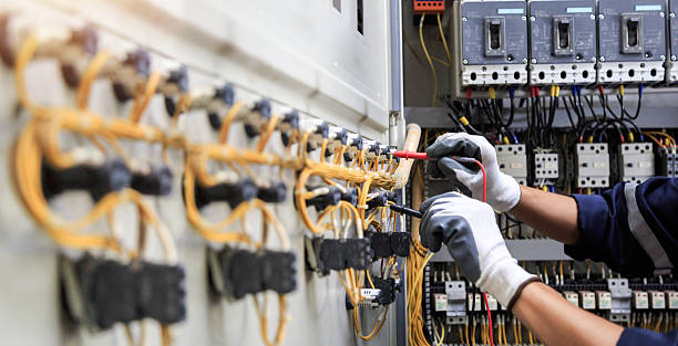 Professional Electrician technician working in Pelican Bay, FL